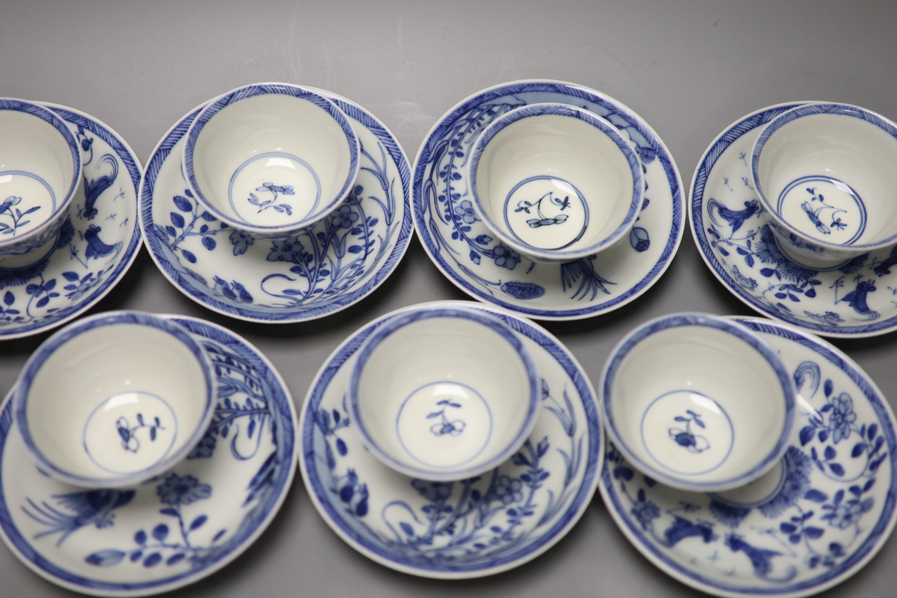 Five Chinese blue and white 'birds' tea bowls and four saucers and three 'chicken' tea bowls and four saucers (16)
